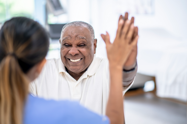 Patient high-fiving doctor